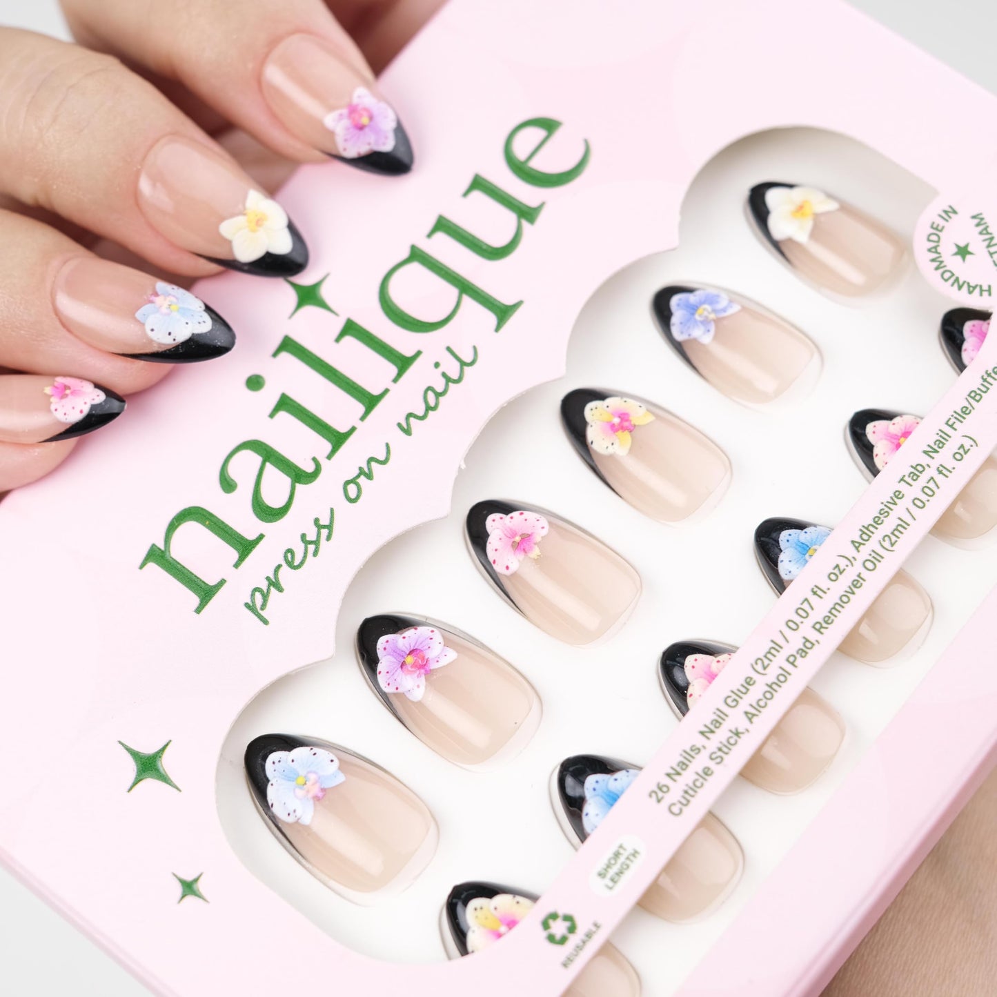 NAILIQUE Press On Nails Short Almond, Handmade Soft Gel Black French Tip Fake Nails with 3D Orchid Flower Art, 26pcs Reusable Nail Tips with Glue & Remover, Salon Quality Summer Manicure