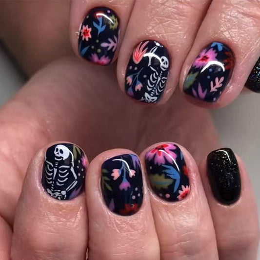 CJDLTS Black Halloween Press on Nails Short Square White Skull False Nail Acrylic Artificial Fingernails Colorful Flowers Design Full Cover Glossy Festival Stick on Nails for Women Supplies 24Pcs