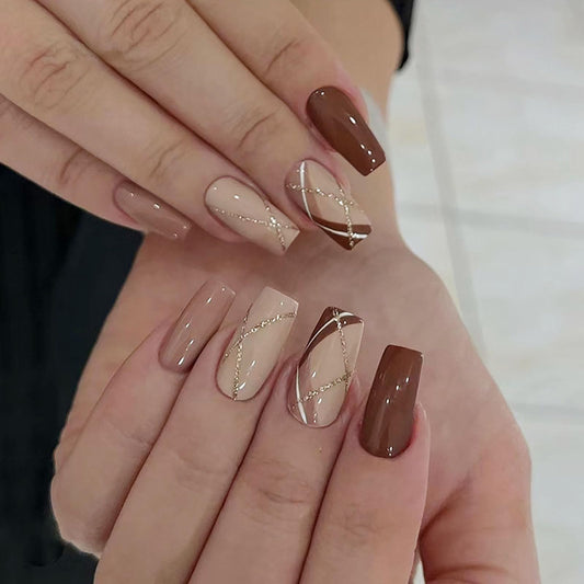 24Pcs Press on Nails Medium Coffin Fake Nails with Golden Glitter White Lines Designs Glossy Nails Press ons Brown Full Cover Glue on Nails Acrylic Nails Artificial Stick on Nails for Women