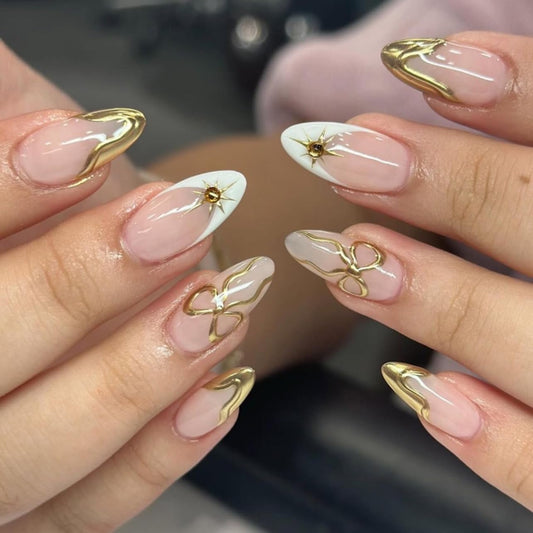 CTTHNBD Medium Press on Nails Almond - Gold French Tip Fake Nails with Bow Design - Starburst Stick on Nails for Women - 24 Pcs