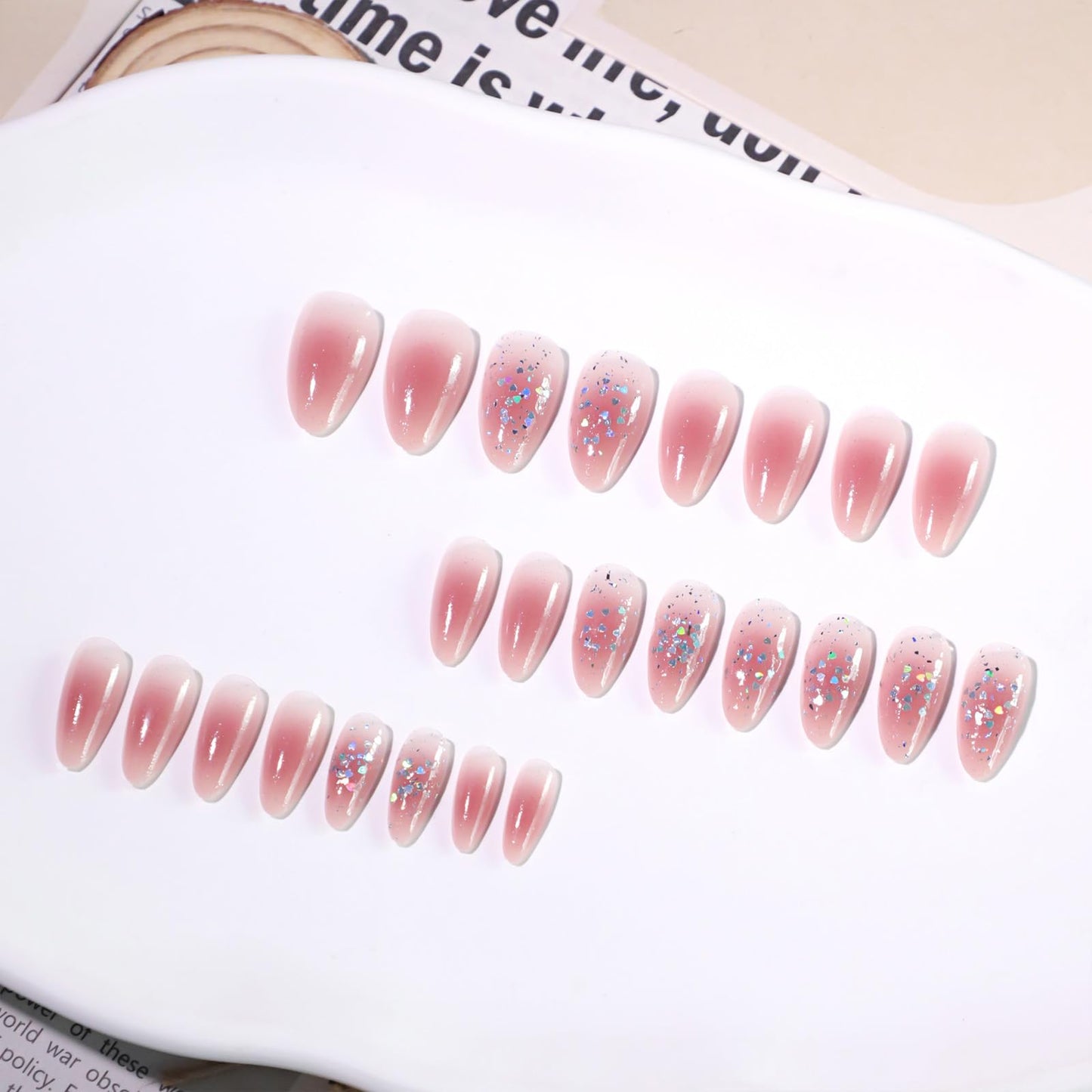 Cute Pink Glitter Press On Nails Almond Shape – Medium Length Nude Gradient Acrylic Fake Nails with Iridescent Hearts & Confetti, 24Pcs Glossy Stick On Nails Kit with Glue for Girls & Women Party