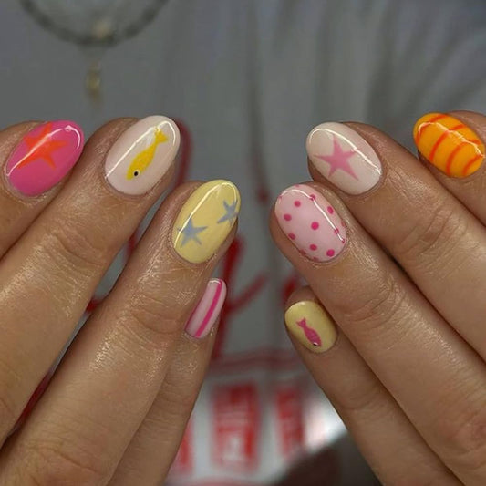QUNQINLI Summer Press on Nails Short Oval Fake Nails Press ons Nail Art Tips with Fish Star Polka Dots Striped Design Multicolor False Nails Full Cover Nude Glossy Glue on Nails for Women 24 Pcs