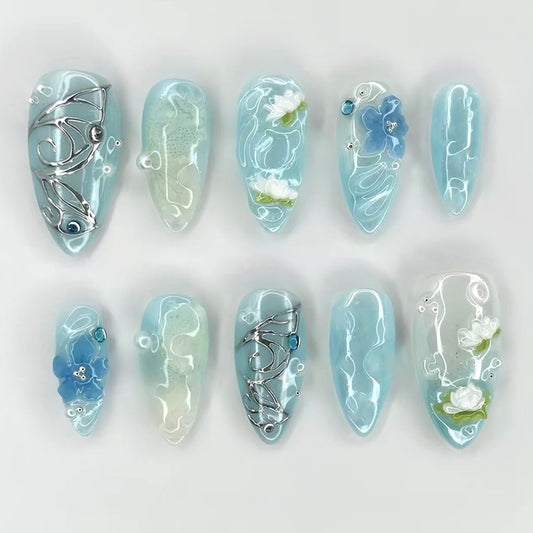 30Pcs Blue Smudge Press on Nails Medium Almond Fake Nails with 3D Rhinestone Pearls Design Butterfly Floral False Nails Lotus Flower Glue on Nail Glossy Full Cover Water Ripples Acrylic Nail for Women