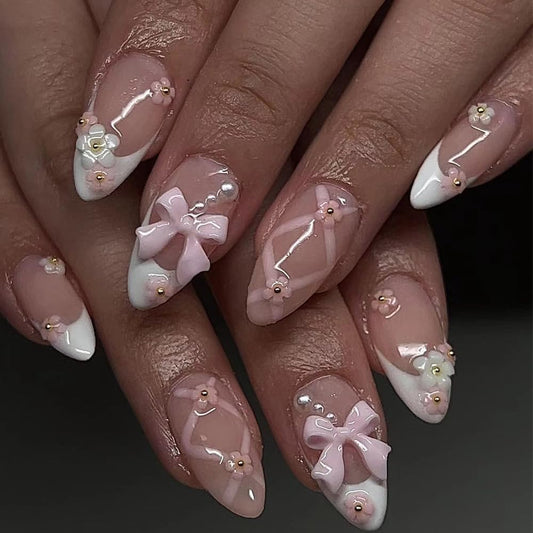 Acrylic Nail Art with Bows and Peal and Rhinestones, French Manicure Style, Almond shape for soft woman and girls