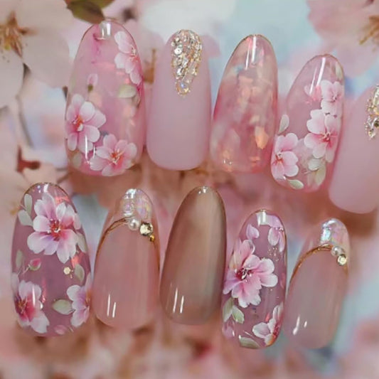 24Pcs Pink Peach Blossom Press on Nails Almond Medium Fake Nails with Flower Designs Glitter 3D Pearl Rhinestones Glue on Nails Pink Floral Acrylic Nails for Women Spring Summer Nail Art Decoration