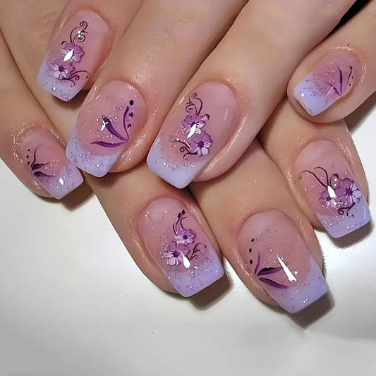 French Press on Nails Medium Short Fake Nails with Glitter Designs Purple Flowers Glue on Nails Translucent Nails Press ons Spring False Nails for Women 24 Pcs