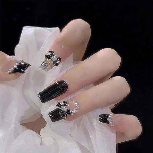 YKZFUI 24Pcs Press on Nails Medium Length Fake Nails with Black Bow Pearl Designs,Artificial Acrylic Full Cover Reusable Coffin False Nails, Women Glue on Nails Set,Stick on Nails for Nail Art
