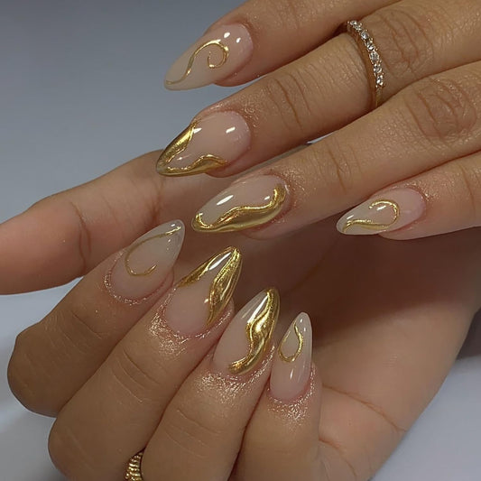 CJDLTS Gold Press on Nails Medium Length Golden 3D Irregular Lines Design False Nail Nude Artificial Stick on Nails Acrylic Press Ons Reusable Glue on Nail for Women 24Pcs