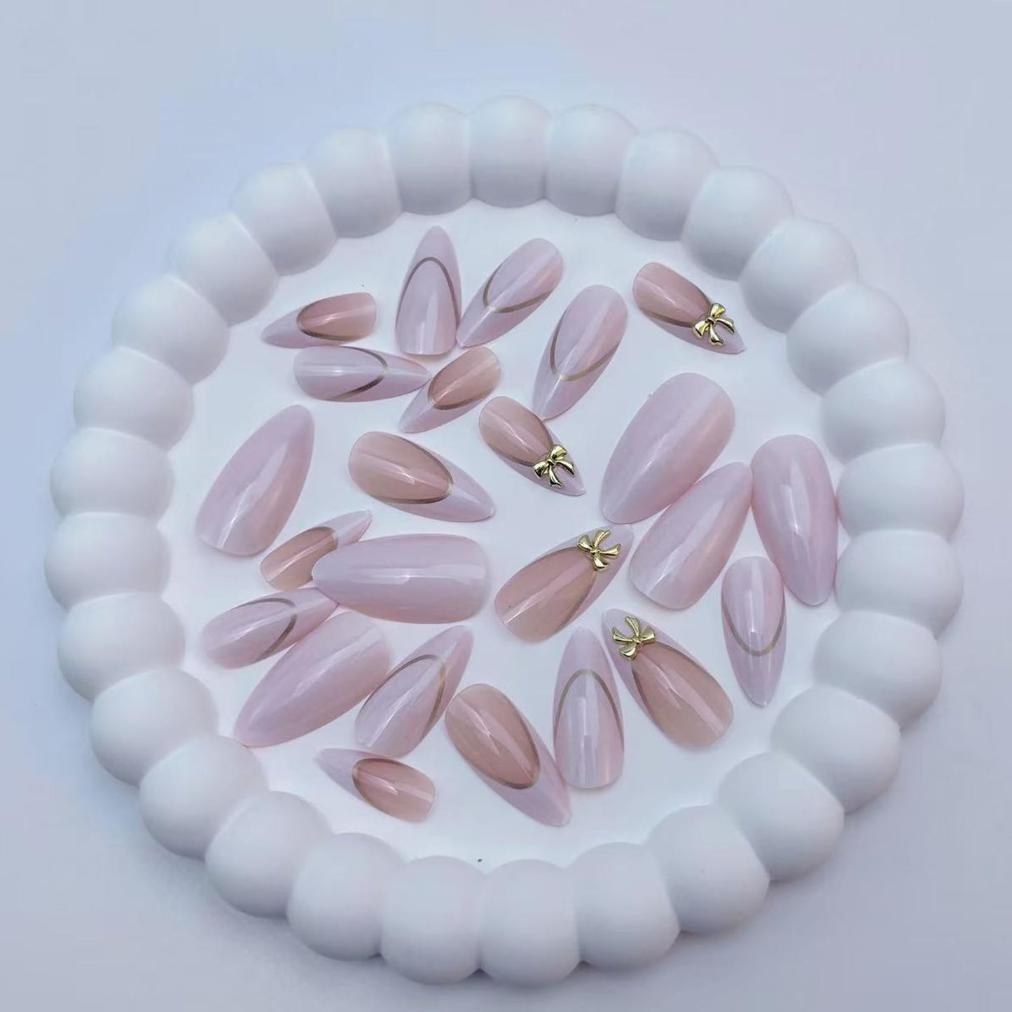 24Pcs Press on Nails Medium Almond Fake Nails,White & Nude Pink French Tip with Gold Lines & 3D Gold Bows Glossy False Nails with Elegant Bow Charms Acrylic Nails Full Cover Stick on Nails for Women
