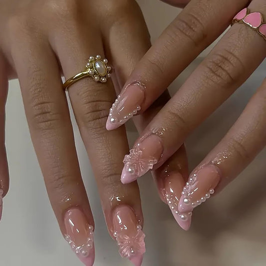 24 Pcs Medium Length Press on Nails Almond False Nails Light Pink RIICFDD French Fake Nails Bows and Pearl Nail Charms Artificial Glossy Full Cover Glamorous Stick on Nails for Women Acrylic Nails