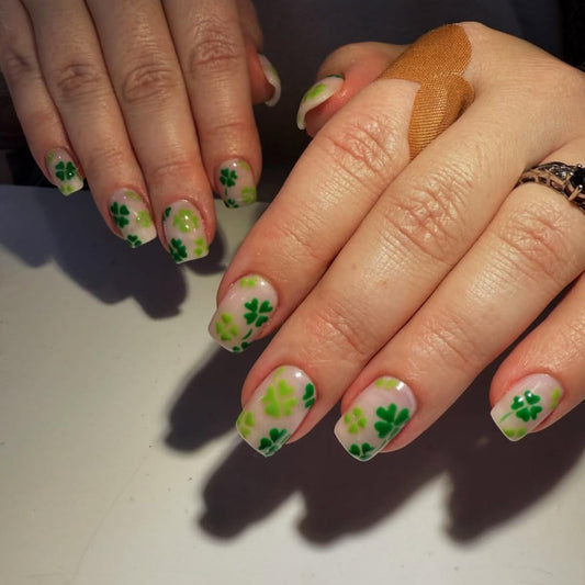 24Pcs St. Patrick's Day Press on Nails Short Square QUNQINLI Fake Nails with Four-Leaf Clover Designs Green Nails Press ons Glossy Full Cover Nude Glue on Nails Reusable Stick on Nails for Women