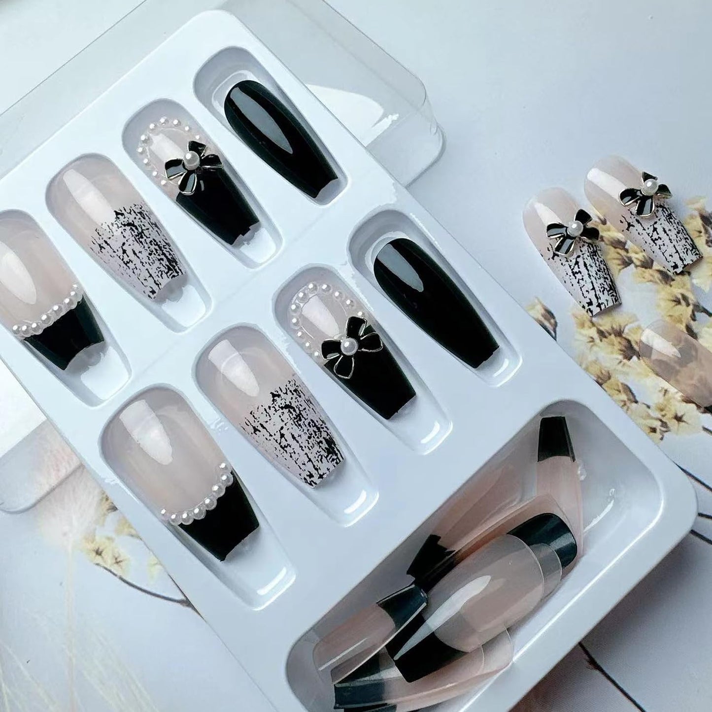 YKZFUI 24Pcs Press on Nails Medium Length Fake Nails with Black Bow Pearl Designs,Artificial Acrylic Full Cover Reusable Coffin False Nails, Women Glue on Nails Set,Stick on Nails for Nail Art