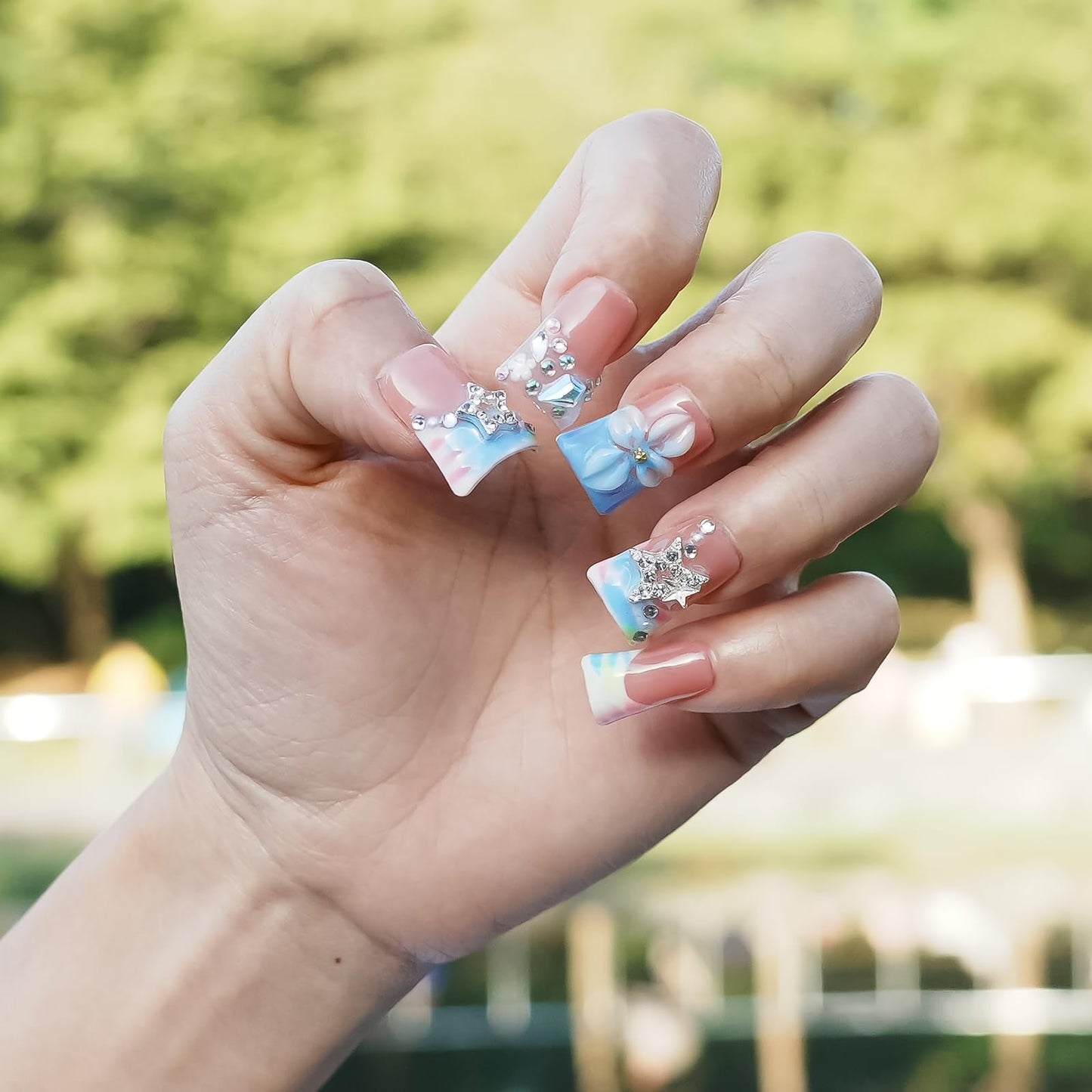 Tesytto Press on Nails Duck Shape 3D Floral Metallic Star Design Luxury Thick Acrylic Fake Nails Rhinestones Petal Flower French Tip Blue False Nails (Pastel Pink-Blue Stellar,M)