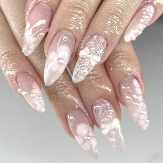 24Pcs Light Pink Press on Nails Almond Medium Fake Nails with White Petals Flower Design 3D Bow Press on Pearl Nails Handmade Full Cover Stick on Nail Almond Shape Acrylic False Nail for Women
