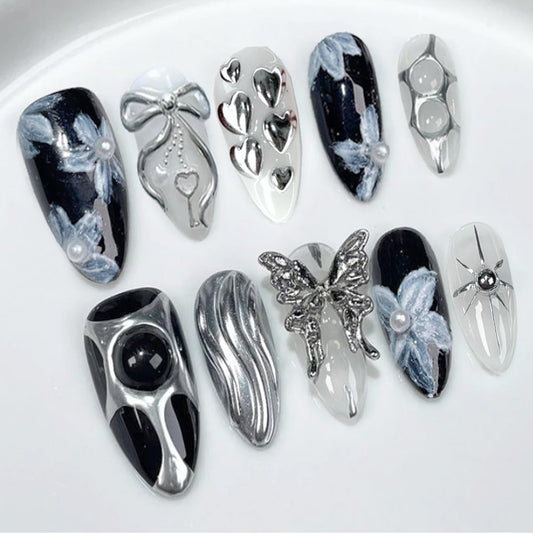 24Pcs Handmade Y2K Press on Nails Almond Fake Nail with 3D Butterfly & Silver Bow Heart Star Irregular Pattern Flower Pearl False Nail Gothic Punk Black Nail Tip French Tip Stick on Nail for Women