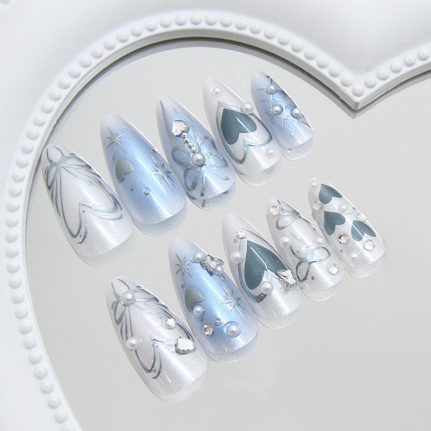 24Pcs Y2k Almond Fake Nail Medium Press on Nails with Blue Love Heart Silver Bow Butterfly Design French Press On Nail Flash Full Cover Artificial Glue on Nails Pearl Rhinestones Nails for Women