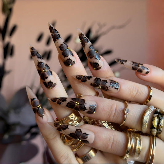 SINHOT Stiletto Press on Nails - Long Fake Nails, Matte Finish, Nude Black Flower & 3D Gold Pearls, Reusable Artificial False Nail Art - 24 Pcs Nail Kit with Glue