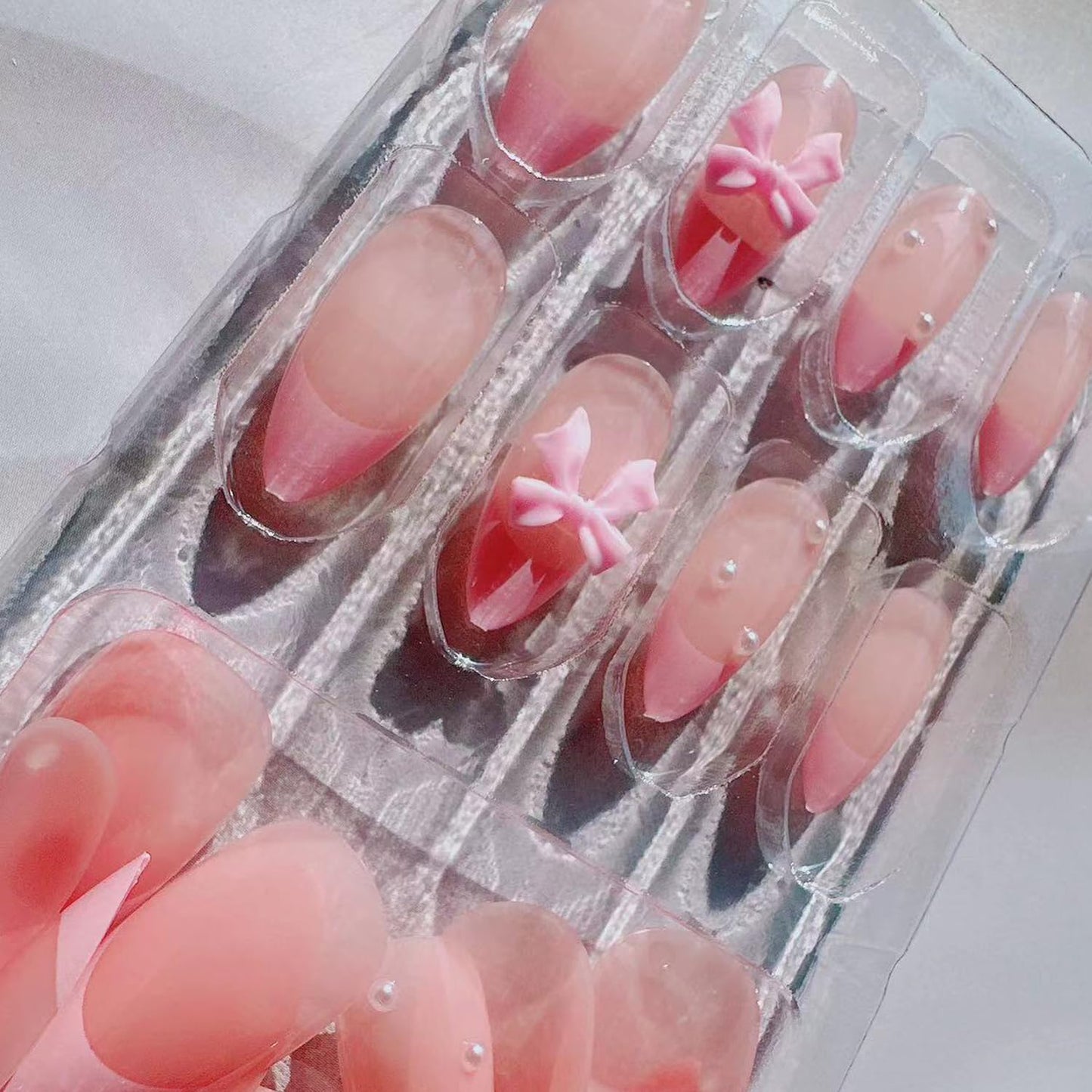 24Pcs French Press on Nails Almond Fake Nails with Bow Pearl Design Pink French Tip False Nails Cute Pink Press on Nail Tips Glossy Artificial Nails Acrylic Stick on Nail for Women Manicure