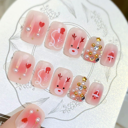 24pcs Christmas Press on Nails Short Square Fake Nails Cute Reindeer False Nails with 3D Pearl Gold Silver Gems Design Winter Pink Glossy Glue on Nails Full Cover Artificial Stick on Nail for Women