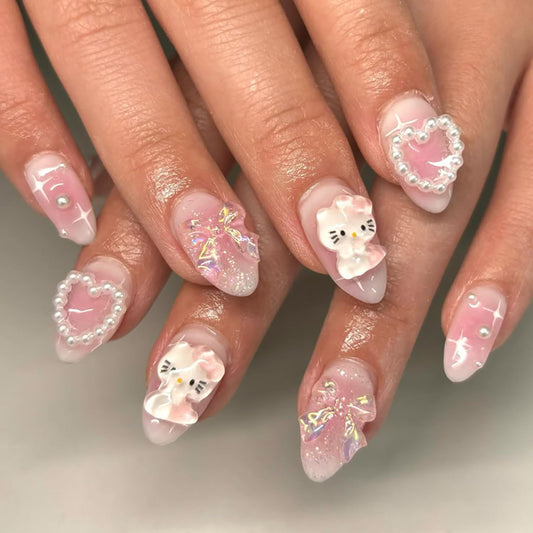 24Pcs Pink Press on Nails Medium Almond Fake Nails with Heart Pearl Bow Cute Rhinestones Designs Cartoon Acrylic Nails Reusable Laser Bow False Nail Cute Cartoon Full Cover Glue on Nails for Women
