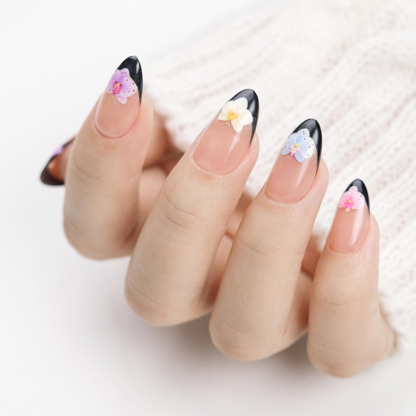 NAILIQUE Press On Nails Short Almond, Handmade Soft Gel Black French Tip Fake Nails with 3D Orchid Flower Art, 26pcs Reusable Nail Tips with Glue & Remover, Salon Quality Summer Manicure
