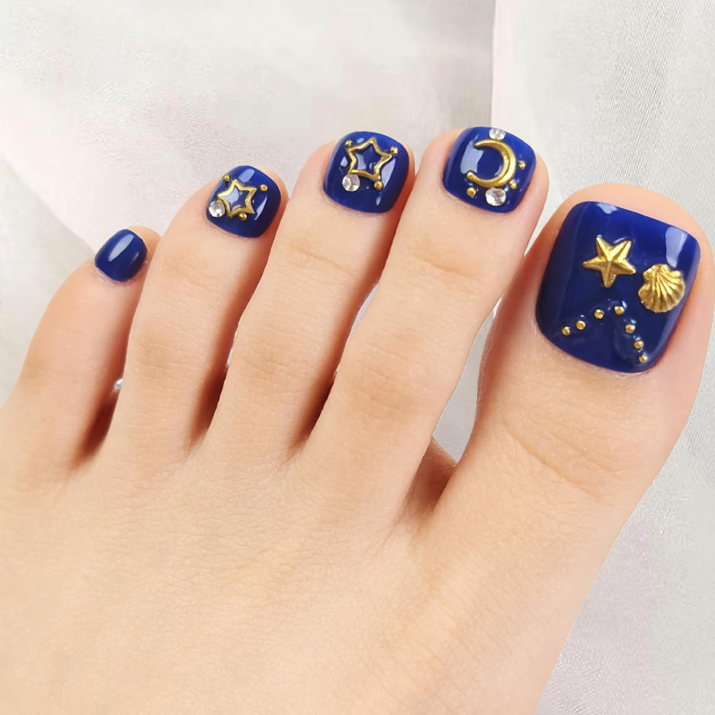 Navy Blue Press on Toenails with Shell Starfish Charms Gold Star Moon Design Fake Toe Nails Glossy Acrylic Toenails Artificial Toe Nails Glue on Summer Press on Toes for Women 24Pcs