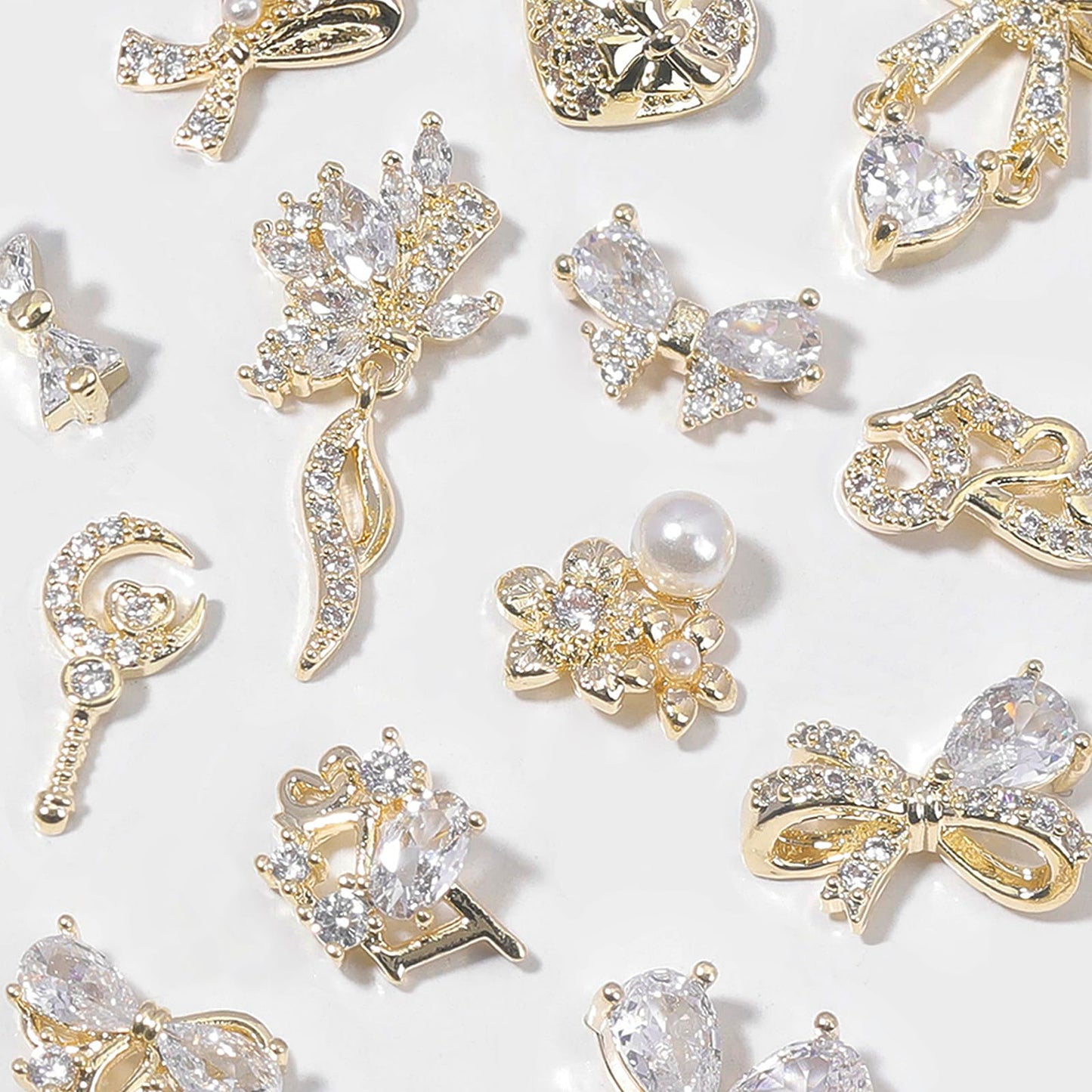 HNUIX Nail Charms and Gems - Gold Copper Zircon, Multiple Shapes 3D Dangle, Metal Luxury Jewelry Rhinestones for Nails 14 Pieces