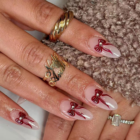 IMSOHOT Press on Nails Medium Almond Fake Nails with Red Bow Design Nude Glossy Full Cover Acrylic False Nails for Women Girls Manicure 24Pcs