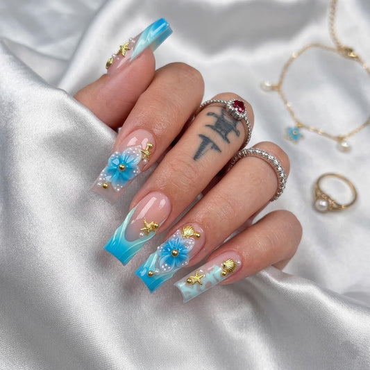 Long Press on Nails Square Fake Nails Blue Acrylic Nail Press ons Seeneey 3D Flowers and Gold Charm Designs Cute Sparkly Beach Stick on Nail for Women 24pcs