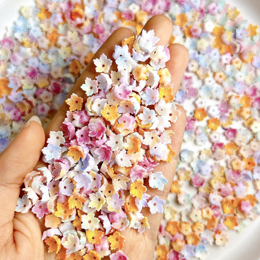 AWDSLUY 200Pcs Colorful Flower Nail Art Charms Cute Spring Summer Floral Nail Charms 3D Mix Color Ombre Flatback Nail Rhinestones Cute Glow in The Dark Blossoms Resin Nails Jewels Nail Gems for Women